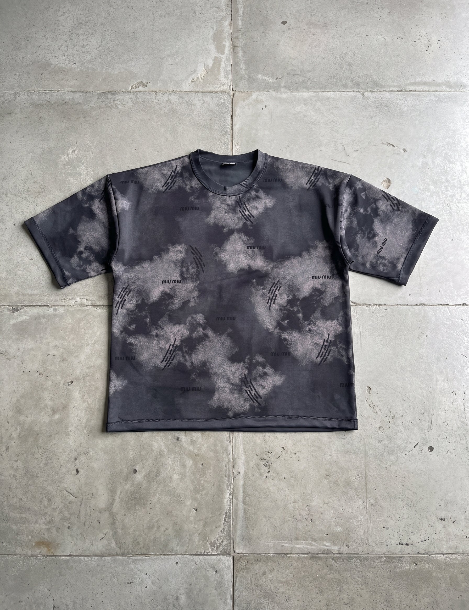 T-shirt_flat_lay_on_cement_202608181831.jpg